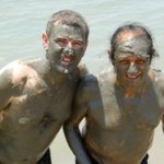 Sean McAllister and Samir Peter covered in mud